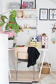 Ornaments on String shelves above white desk in girl's bedroom