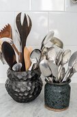 Cutlery and kitchen utensils in ceramic pots