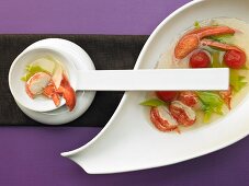 Clear lobster soup with leek and tomatoes