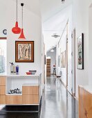 Bright hallway with polished concrete floor and art objects
