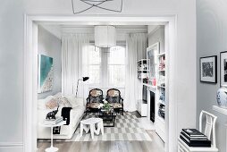 Passage to the elegant living room in gray and white