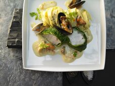 Monkfish with savoy cabbage, mussels and saffron noodles