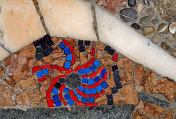 Blue-red mosaic in pavement