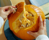Hollow out the pumpkin, lift off the lid