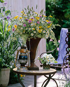 Meadow bouquet in an iron vase