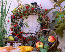 Tie wreath of berry jewelery and clematis fruit stands