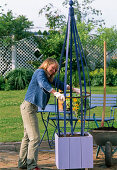 Bucket with climbing frame