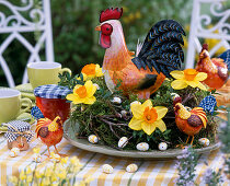 Plate wreath with branches and moss, taps, Easter eggs