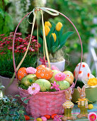 Pink handle basket with Easter eggs