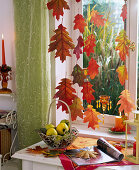 Oak leaves as autumnal window decoration