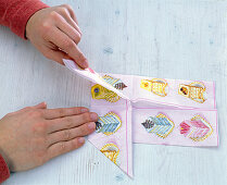 Folding a napkin into a pinwheel (4/7)