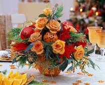 Roses bouquet with spiked oranges and Christmas baubles