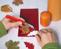 Decorating candles with wax leaves (1/3)
