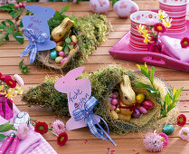 Bag of moss with chocolate bunny and chocolate eggs