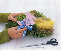 Bag of moss with chocolate bunny and chocolate eggs