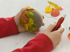 Balls with autumn strawberries leaves