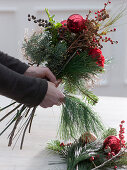 Bouquet with red carnations and Christmas tree balls (2/3)