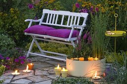 Evening seating area with white bench