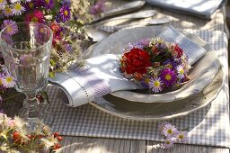 Table decoration with asters and roses