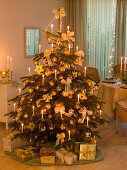 Christmas tree decorated in white and gold