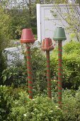 Colorful painted clay pots on pylons as beneficial shelter