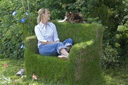 Grass sofa made from construction steel mats and chicken wire