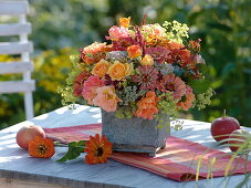Late summer bouquet of roses, zinnias and stonecrops
