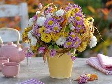 Autumn bouquet of Chrysanthemum (autumn chrysanthemum) and Symphoricarpos