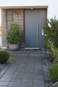 House entrance with modern grey front door