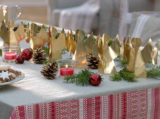 Table decoration with homemade angels made of gold foil