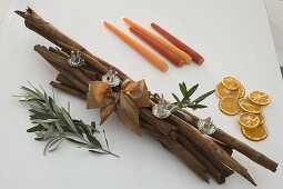 Unusual Advent arrangement made of cinnamon sticks 4/5