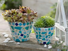 Glue clay pots with turquoise mosaic
