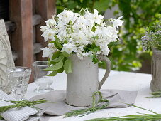 White scented bouquet in pottery jug