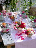 Table decoration with roses and lanterns