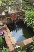 Artist's garden: Water basin with water spout