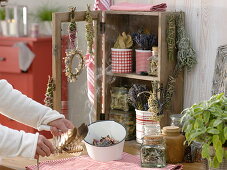 Small cupboard with dried herbs and incense bundles