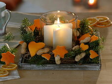 Cutting out orange peel for tree decoration