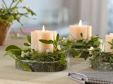 Simple Advent wreath of individual star candles on tree disks