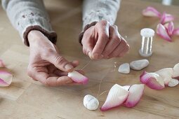 Homemade ice wind lights with rose petals