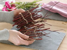 Dogwood branches as plug-in aid for ranunculus bouquet