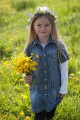 Girl with bouquet of buttercups