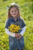 Girl with bouquet of buttercups