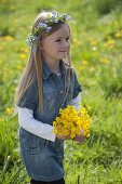 Girl with bouquet of buttercups