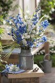 Blue and white bouquet in old zinc pot