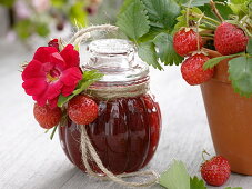 Glass with strawberry jam, decorated to give as a gift