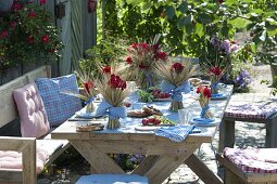 Bavarian table decoration with cereals and geraniums