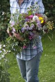 Woman with freshly cut country garden bouquet