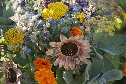 Bouquet of herbs with borage, calendula, helianthus