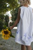 Girl with Helianthus (sunflowers)