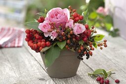 Small bouquet of pink (roses and rose hips), elderberries